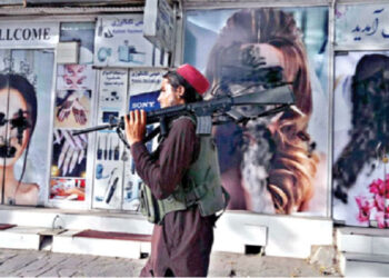 WRITING ON THE WALL: Soon after Taliban capture, images of women were defaced in public places