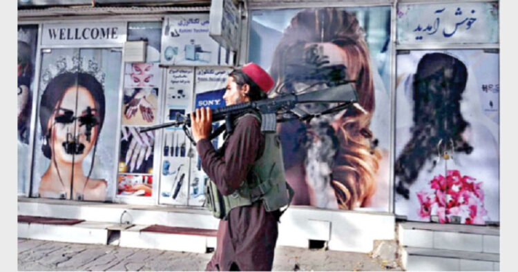 WRITING ON THE WALL: Soon after Taliban capture, images of women were defaced in public places