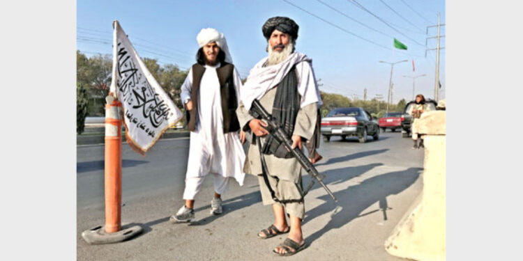 A Talibani terrorist standing outside the Interior Ministry in Kabul, Afghanistan, August 16, 2021