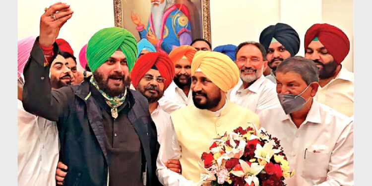Punjab Congress President Navjot Singh Sidhu and AICC in-charge of Punjab Harish Rawat congratulating Punjab CM Charanjit Singh Channi, in Chandigarh