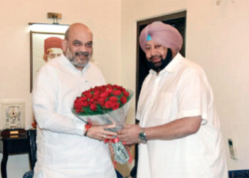 Captain Amarinder Singh with Union Home Minister Amit Shah on his residence in New Delhi