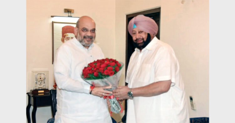 Captain Amarinder Singh with Union Home Minister Amit Shah on his residence in New Delhi
