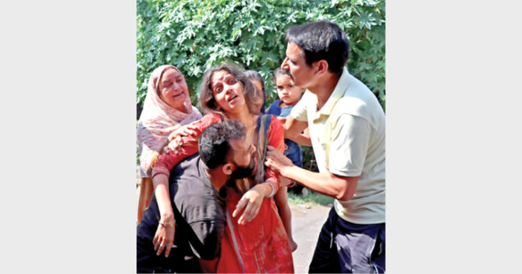 Family members of school teacher mourning after getting informed of his alleged killing by terrorist at Sangam Edgar near Srinagar