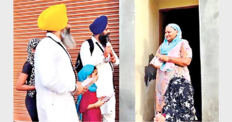 SGPC preachers distributing Sikh literature at Sultanwind village in Amritsar district of Punjab