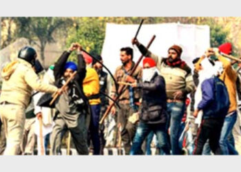 The so-called farmers attacking a policeman with swords and lathis near ITO in Delhi on January 26, 2021