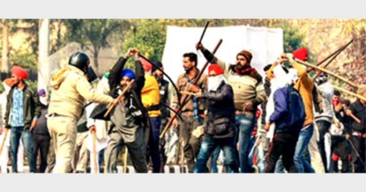 The so-called farmers attacking a policeman with swords and lathis near ITO in Delhi on January 26, 2021