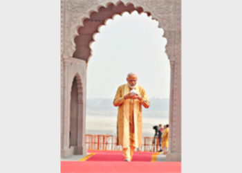 Prime Minister Narendra Modi carrying Gangajal before performing puja at Kashi Vishwanath Temple on December 13, 2021