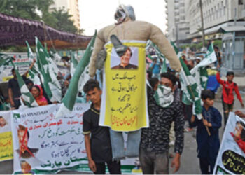 Protesters carrying an effigy of Imran Khan as they take part in an anti-government demonstration in Karachi, recently