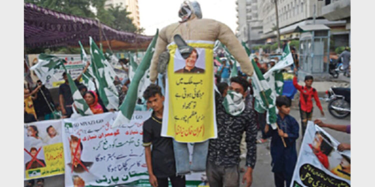 Protesters carrying an effigy of Imran Khan as they take part in an anti-government demonstration in Karachi, recently