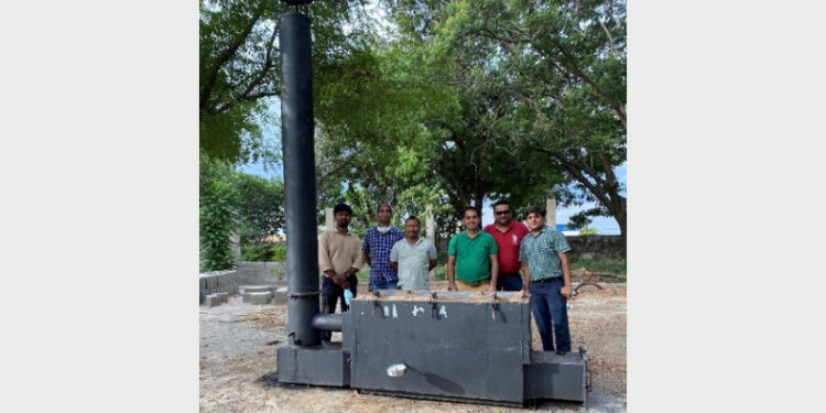 IIT Guwahati researchers with novel improved natural draft charcoal retort (Photo Credit: India Science Wire)