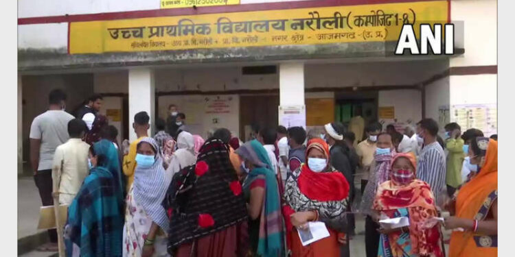 Voters at polling booth in Azamgarh (Photo Credit: ANI)