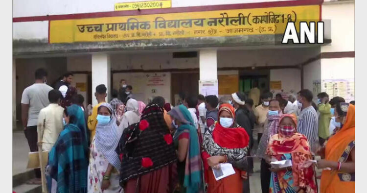 Voters at polling booth in Azamgarh (Photo Credit: ANI)
