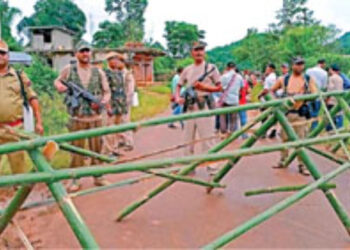 Assam Police personnel stand alert at Umlaper, a border village claimed by both Meghalaya and Assam