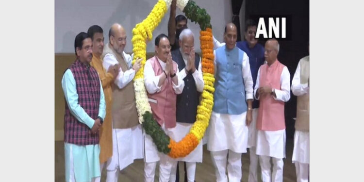 PM Modi and BJP national president J P Nadda garlanded by party leaders at BJP parliamentary party meeting (Photo Credit: ANI)