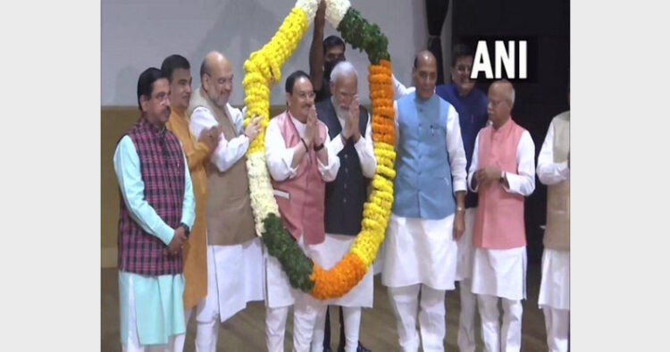 PM Modi and BJP national president J P Nadda garlanded by party leaders at BJP parliamentary party meeting (Photo Credit: ANI)