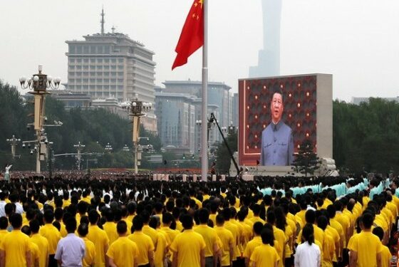 A giant screen shows Chinese President Xi Jinping singing the national anthem during a flag-raising ceremony at the event marking the 100th founding anniversary of the Communist Party of China, on Tiananmen Square in Beijing, China July 1, 2021. REUTERS/Carlos Garcia Rawlins - RC2CBO9GXFUU