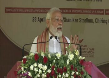 Prime Minister Narendra Modi speaking at a public rally in Assam (Photo Souce: ANI)