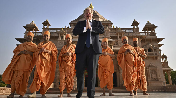 UK PM Boris Johnson with sadhus in Akshardam Temple (Photo Source: AFP)