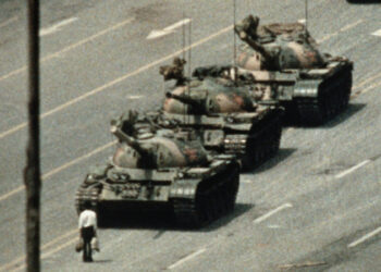 Man standing in front of tanks in Tiananmen Square (Photo Source: Getty Images)