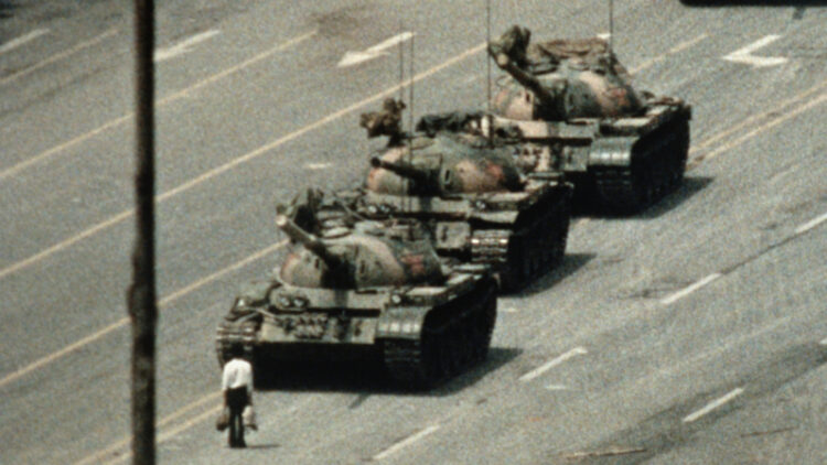 Man standing in front of tanks in Tiananmen Square (Photo Source: Getty Images)