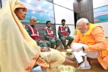 Prime Minister Narendra Modi washes the feet of sanitation workers in Varanasi. He said he would cherish the moment forever
