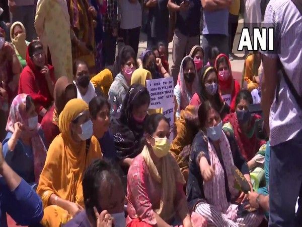 Kashmiri Pandit government workers, along with their families protesting against the killing of Rahul Bhat (Photo Source: ANI)