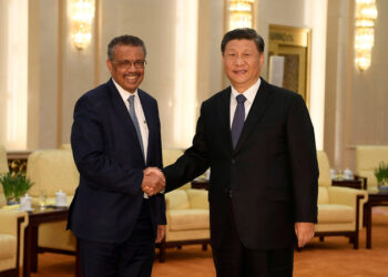 WHO Director General Tedros Adhanom shaking hands with Chinese President Xi Jinping before a meeting at the Great Hall of the People in Beijing, China (File/REUTERS)