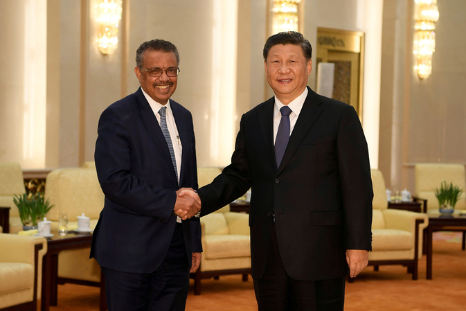 WHO Director General Tedros Adhanom shaking hands with Chinese President Xi Jinping before a meeting at the Great Hall of the People in Beijing, China (File/REUTERS)