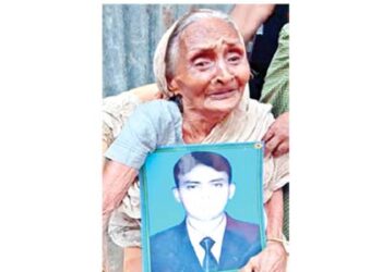 An old Hindu woman mourns the death of her relative in  Bangladesh