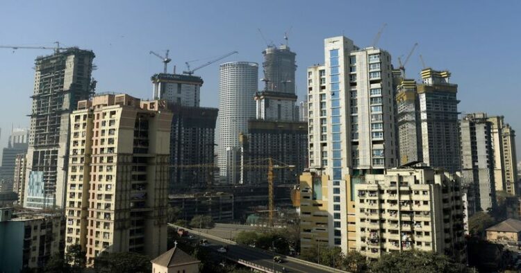 Under construction residential buildings rise into the skyline of Mumbai on January 27, 2017. / AFP / PUNIT PARANJPE        (Photo credit should read PUNIT PARANJPE/AFP/Getty Images)
