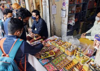 People shop for Green crackers ahead of the Diwali festival in New Delhi in 2020