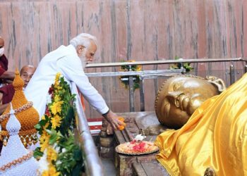 PM Narendra Modi offers flowers to the reclining statue of Lord Buddha during his visits to the Mahaparinirvana Temple in 2021