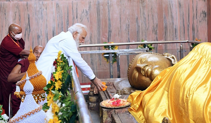 PM Narendra Modi offers flowers to the reclining statue of Lord Buddha during his visits to the Mahaparinirvana Temple in 2021
