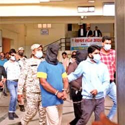 National Investigation Agency (NIA) officials produce Popular Front of India (PFI) leaders before the District Court, Bhopal, after arresting them from Indore and Ujjain during raid