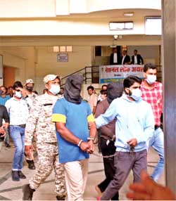 National Investigation Agency (NIA) officials produce Popular Front of India (PFI) leaders before the District Court, Bhopal, after arresting them from Indore and Ujjain during raid