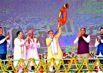 Prime Minister Narendra Modi blows a trumpet at the inauguration and stone-laying foundation ceremony of development projects in the presence of Union Minister for Youth Affairs and Sports Anurag Thakur, Himachal Pradesh Chief Minister Jai Ram Thakur and BJP National President JP Nadda, in Bilaspur