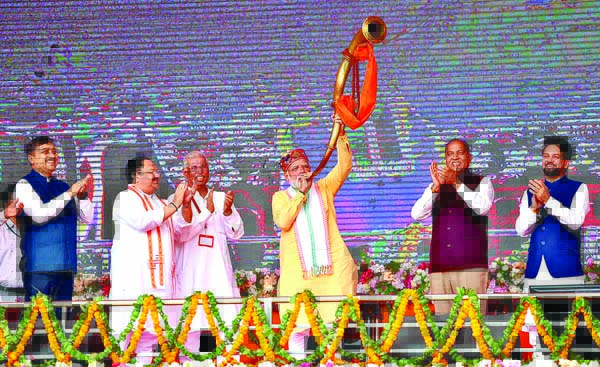 Prime Minister Narendra Modi blows a trumpet at the inauguration and stone-laying foundation ceremony of development projects in the presence of Union Minister for Youth Affairs and Sports Anurag Thakur, Himachal Pradesh Chief Minister Jai Ram Thakur and BJP National President JP Nadda, in Bilaspur