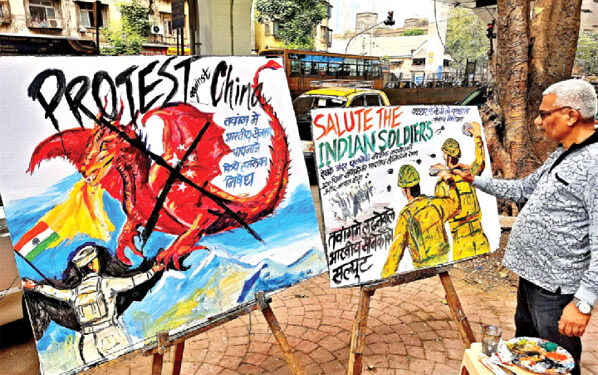 A teacher of Gurukul School of Art makes painting depicting India-China clash along the Line of Actual Control (LAC) near Tawang in Arunachal Pradesh, in Mumbai