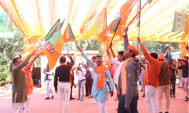 Celebrating the victory, party workers were seen holding party flags, dancing on the beats of dhol and performing garba