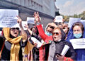 Afghan women participating  in a protest march for their rights under the Taliban rule in the downtown area of Kabul