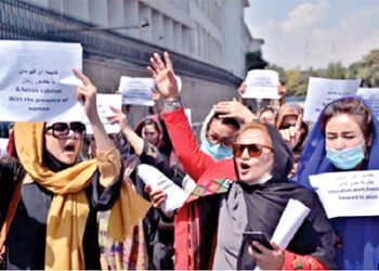 Afghan women participating  in a protest march for their rights under the Taliban rule in the downtown area of Kabul