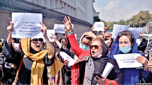 Afghan women participating  in a protest march for their rights under the Taliban rule in the downtown area of Kabul