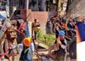 Followers of Amritpal Singh clash with the police while breaking through barricades at the police in protest against filing of FIR against him and his associate