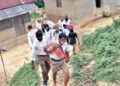 RSS Swayamsevaks distributing  grocery kits to tribal villages in the hilly regions of Khowai district, Tripura