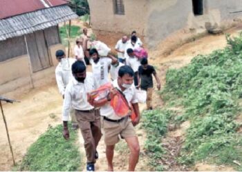 RSS Swayamsevaks distributing  grocery kits to tribal villages in the hilly regions of Khowai district, Tripura