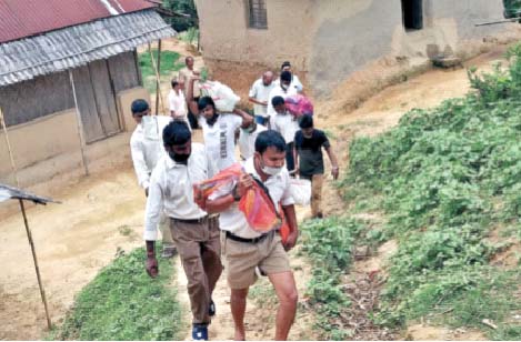 RSS Swayamsevaks distributing  grocery kits to tribal villages in the hilly regions of Khowai district, Tripura