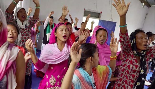Worshippers at a Christian church in Thakaldanda, Nepal. The country has one of the fastest-growing Christian populations in the world as Missionaries are luring the poor with material offerings