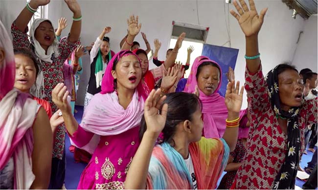 Worshippers at a Christian church in Thakaldanda, Nepal. The country has one of the fastest-growing Christian populations in the world as Missionaries are luring the poor with material offerings