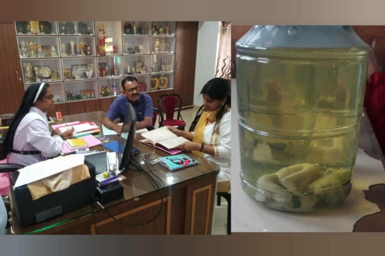 Onkar Singh and Nivedita Sharma with the principal sister Grace, Foetus recovered on the right