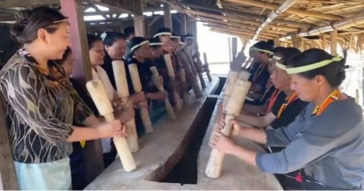 Nagaland’s Member of Parliament to Rajya Sabha, S Phangnon Konyak and other are seen participating in beating of the log drum for the first time by women at Wansoi village, under Noklak district